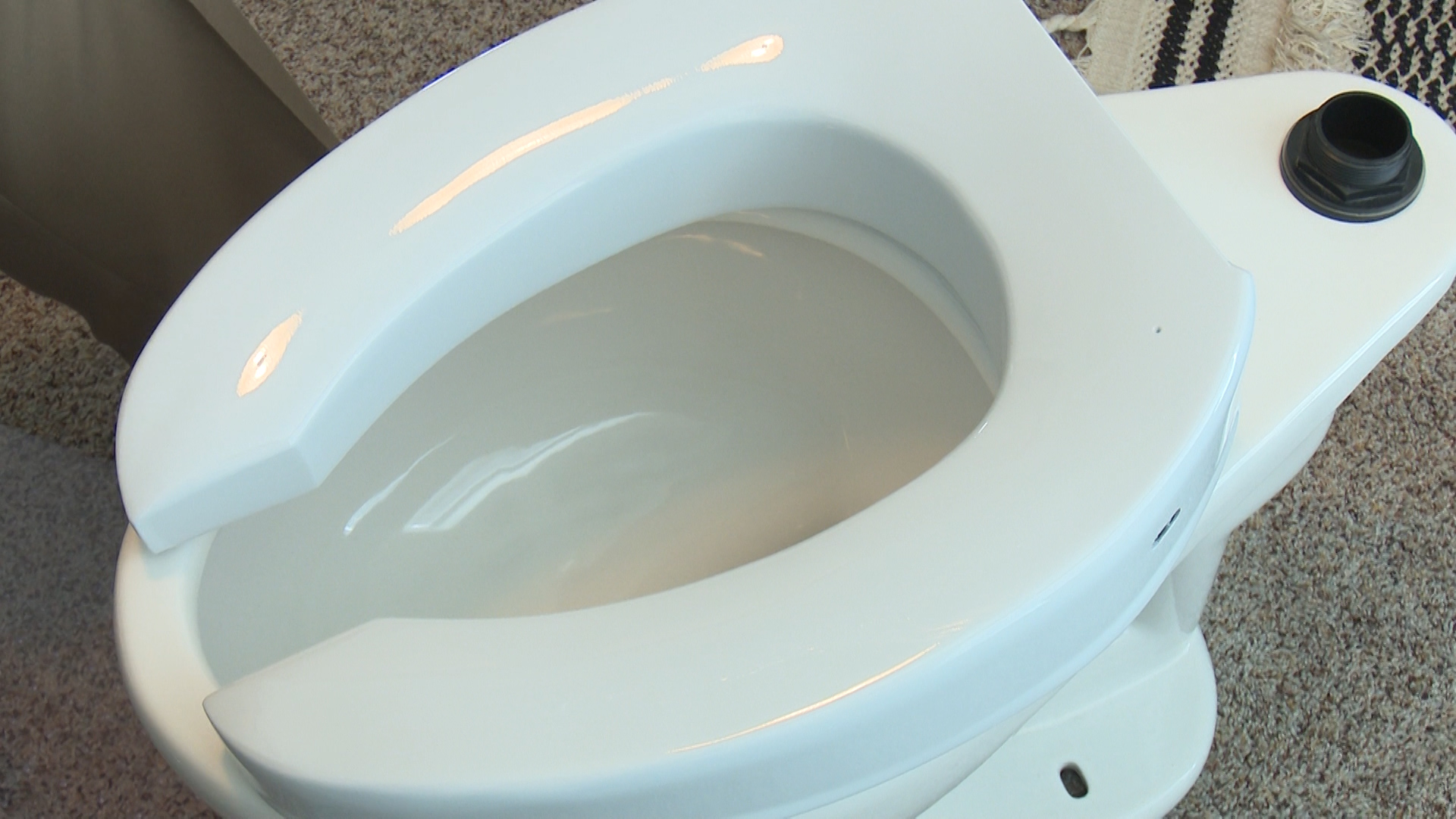 Bannock County clerk invents Washie a self cleaning toilet seat
